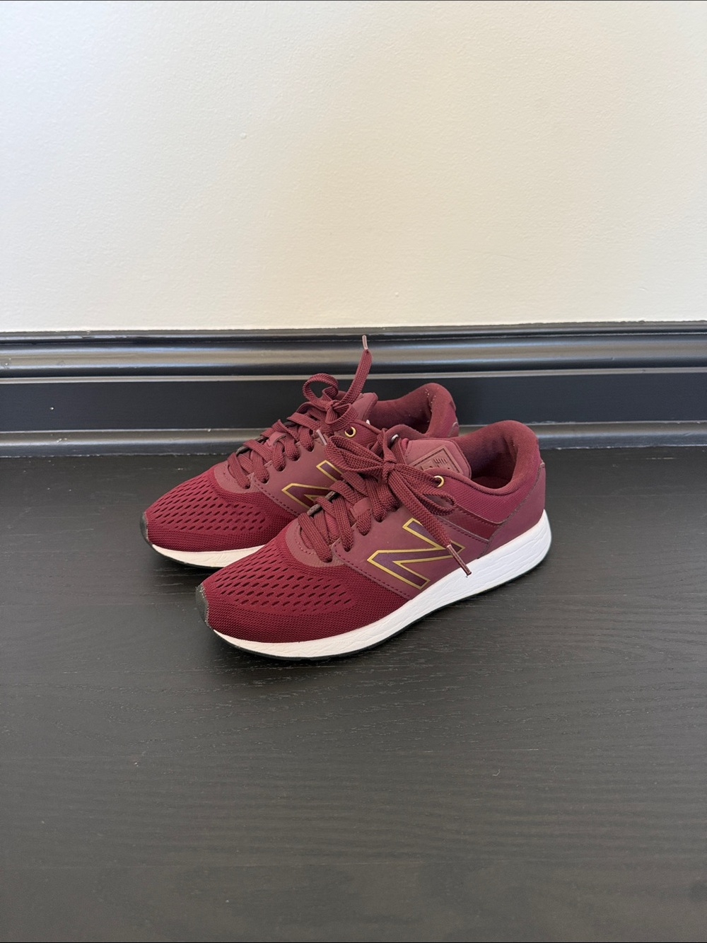 New Balance Burgundy Sneakers with White Soles and Gold Logo